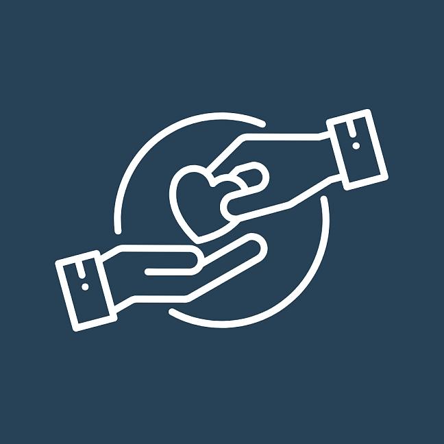 Zwei Hände reichen sich ein Herz